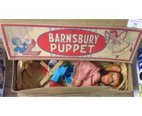 A boxed Barnsbury puppet chimpanzee.