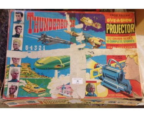 A c1960s Chad Valley Thunderbirds Give-a-Show projector & slides.