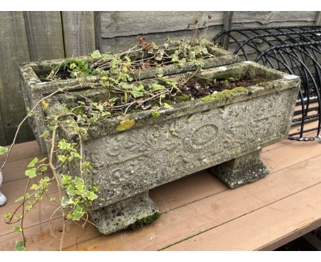 Pair of stone trough planters on plinths 