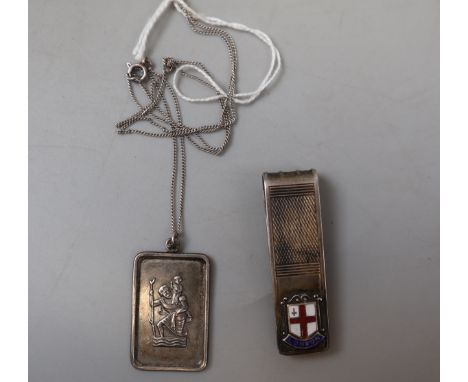 Stirling silver money clip together with a silver pendant 