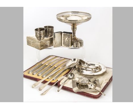 A collection of silver and white metal items, including a tazza, a cigarette box, two ashtrays, a cased set of silver butter 