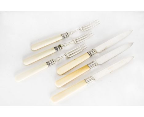 A Victorian set of twelve silver and ivory dessert knife and fork by Henry Wilkinson Ltd  