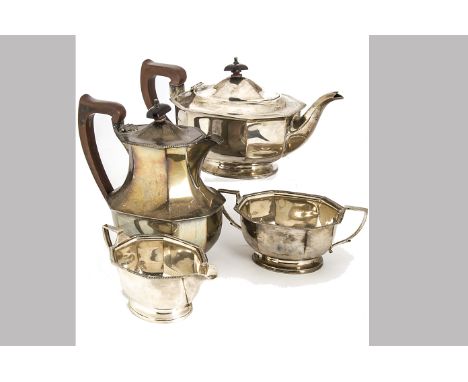 An Art Deco period silver four piece tea set by Adie Bros, comprising octagonal teapot, hot water jug, sugar basin and milk j