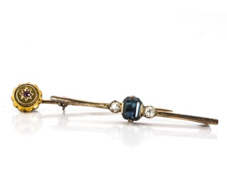 A 15ct gold ruby gypsy set stick pin, together with an Art Deco tourmaline and diamond set bar brooch, 3.7g (2) 