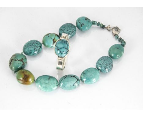 A silver and turquoise cuff bangle, the oval cabochon in plain setting with hinged clasp together with a large Mexican turquo