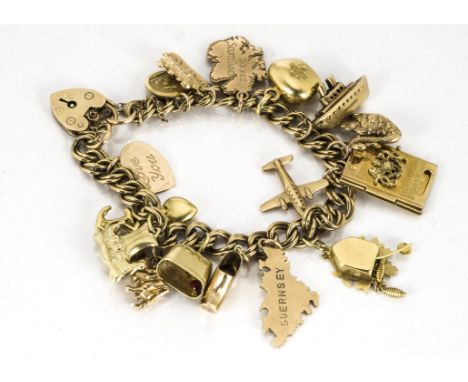 A 9ct gold flattened curbed link charm bracelet, set with multiple charms including Swiss cow bells, one with enamel edelweis