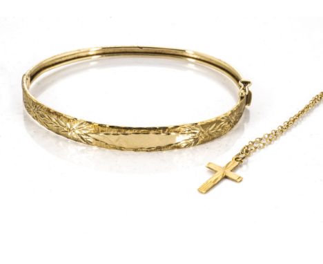 A 9ct gold bangle, with engraved leaf decoration together with a 9ct gold cross pendant and gold chain, (3) 6.6g 