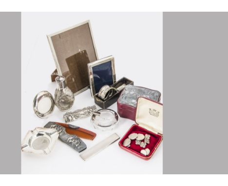 A group of silver and white metal collectables, including two sets of five buttons, a leatherette box with silver panel, thre