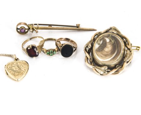 A 19th Century gilt metal mourning brooch, the plaited and scroll hair set in an oval surround with a box back to reverse, to