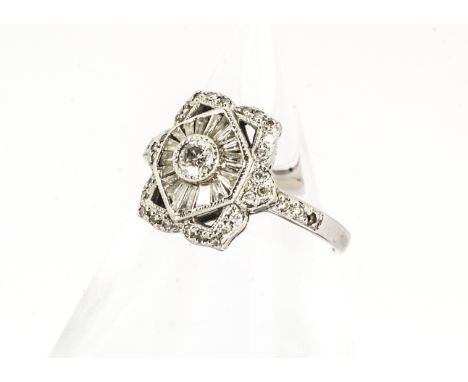 An 18ct gold Art Deco style diamond set tablet ring, the central diamond with lozenge shaped central setting set with baguett