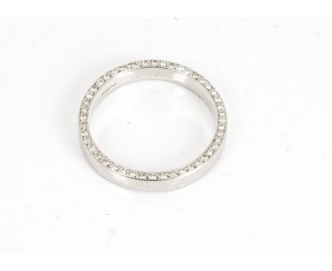 A platinum eternity ring, the court shaped band with brilliant cut diamonds set to side of band, ring size M, 5.1g 