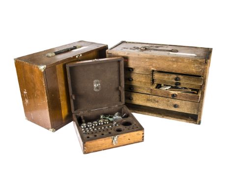 Two vintage wooden watch repairers cabinets, with some contents of tools and spare parts, one cabinet by Moore &amp; Wright, 