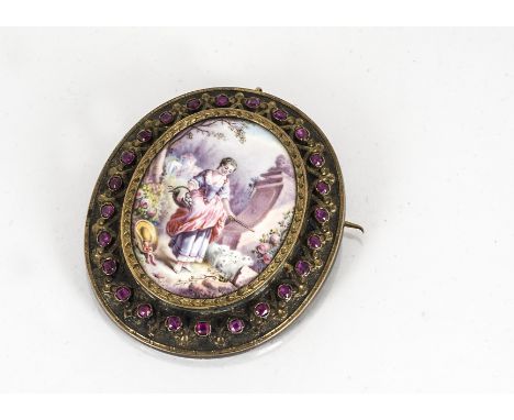 A 19th Century oval enamel brooch, with a border of rectangular cut rubies, the central oval panel decorated with a shepherde