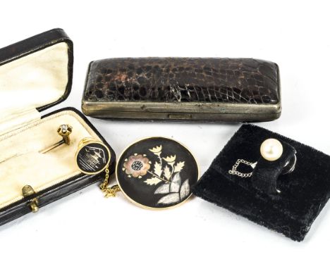 A gold and diamond set stick pin, in fitted case, from Sidney Smith, a cultured pearl tie pin, a Japanese Shakudo tie pin and