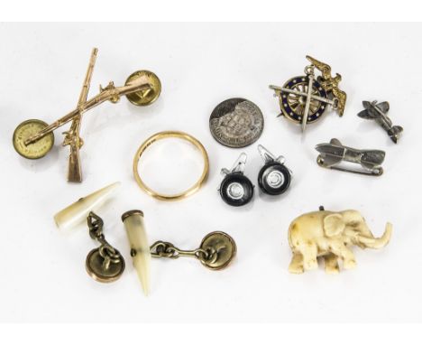 A 22ct gold court shaped wedding band, ring size T, 3.8g, together with two American military pin badges, a pair of mother of