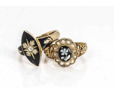 An 18ct gold Victorian memorial ring, centred with a sardonyx carved flower on a bloodstone mount surrounded by seed pearls o