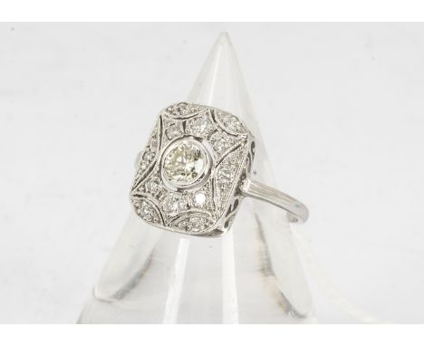 An Art Deco style diamond 18ct marked white gold ring, the rectangular tablet setting centred with brilliant cut diamond with