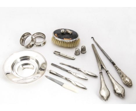 A modern silver Armada dish by RC, together with a pair of silver napkin rings, silver handled curling tongs, button hook and