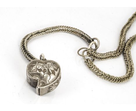 A Chinese white metal heart shaped hinged pendant, with open recess for prayer scroll, on a fine white metal chain, total len