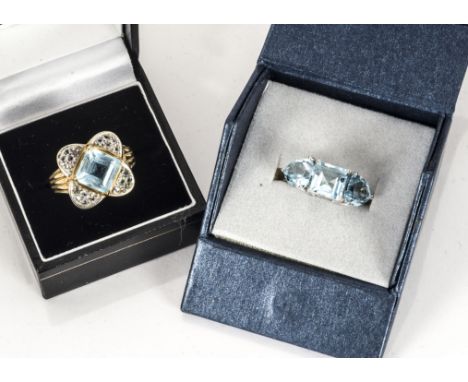 ANNOUNCE: Both rings in this lot are 9ct gold.Two topaz dress rings, one three stone sky blue example in white 18ct gold, rin