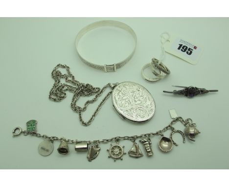 A Large Hallmarked Silver Oval Locket Pendant, on a chain, a hallmarked silver expanding bangle, a dainty charm bracelet, a B