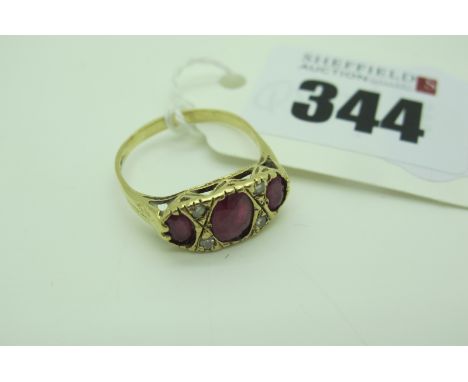 A Ruby and Diamond Set Ring, of Victorian style, graduated set, stamped "375" (finger size O) (2.1grams). 