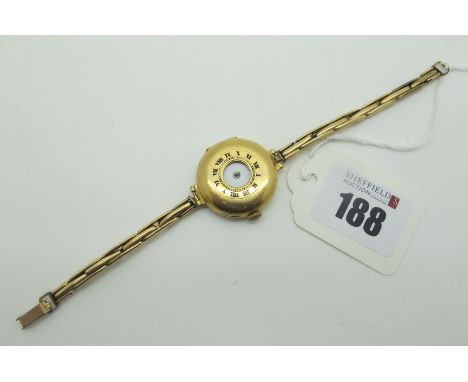 A Vintage 18ct Gold Cased Ladies Wristwatch, of half hunter style, the white dial with black and blue Roman numerals (lacking