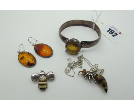 A Modern Novelty Amber Inset Pendant, (indistinctly stamped), on a fine chain; Together with A Novelty Amber Set Bee Brooch /
