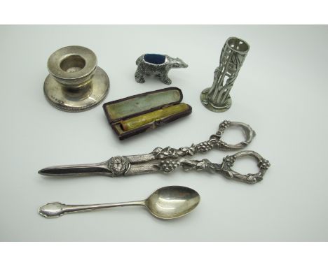 A Hallmarked Silver Dwarf Candlestick, (weighted); a hallmarked silver teaspoon, a novelty pin cushion, decorative pair of gr