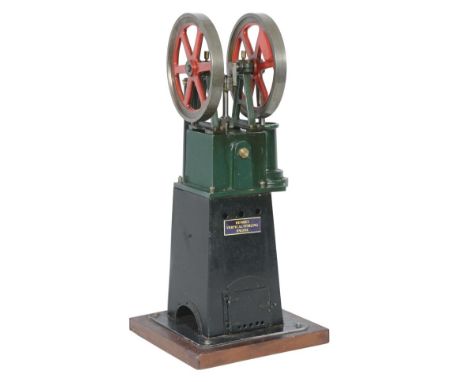 A model of a Henrici vertical hot air engine, built by the late Mr Brian Marshall of Chichester, having twin-spoked 14cm diam