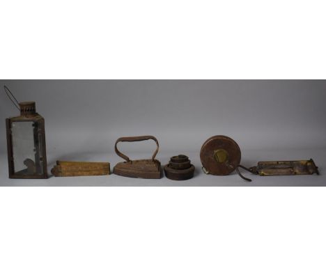 A Collection of Vintage Curios to Include Leather Cased Tape Measure, Folding Carpenters Ruler, Flat Iron, Spring Balance, Sc