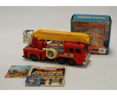 A boxed Liberation friction driven crane truck, MF159; together with a boxed Rutland Product weighbridge; and a Corgi rocket 