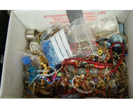 A box of miscellaneous costume jewellery to include various beaded necklaces, enamel bangles etc