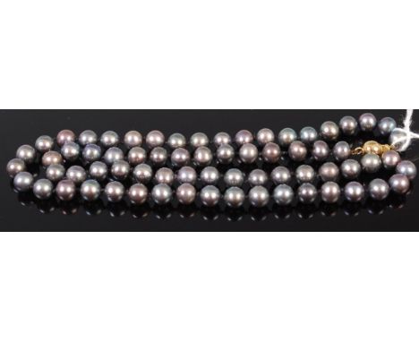 A knotted  grey cultured pearl necklace having 9ct gold ball clasp, 46cm