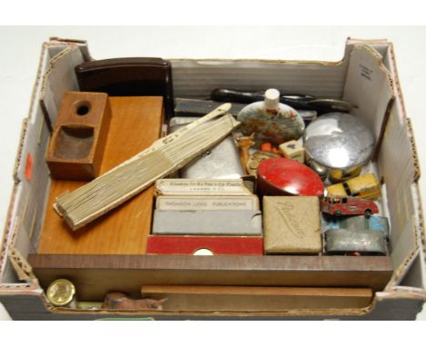 A box of miscellaneous items to include; rosewood cribbage scorer, playing cards, playworn diecast, bakelite cigarette case e