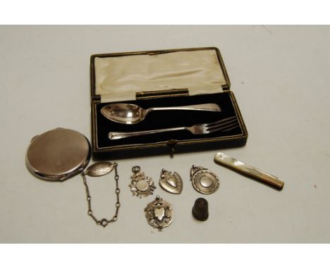 An early 20th century silver two-piece christening set, in fitted leather case; together with a ladies silver engine turned c