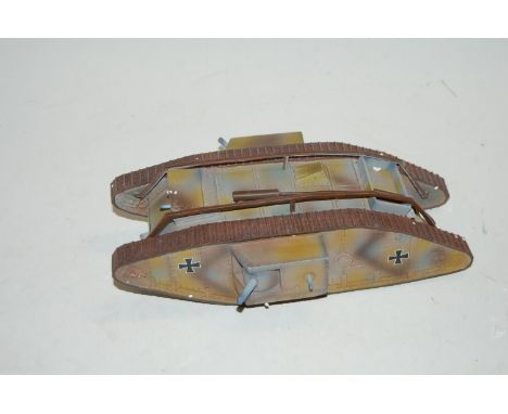 A 1/32 scale pewter military model of a WWI captured German Mk4 tank 