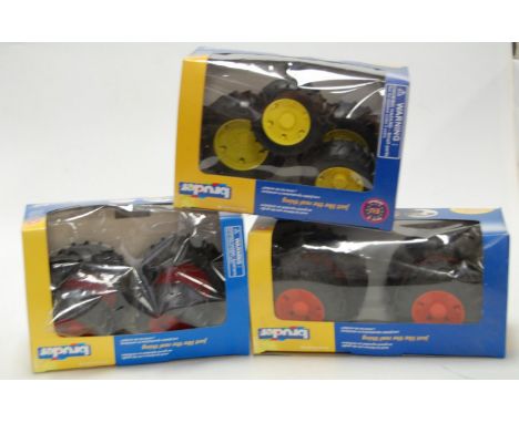A large collection of boxed Bruder German tractor accessories 