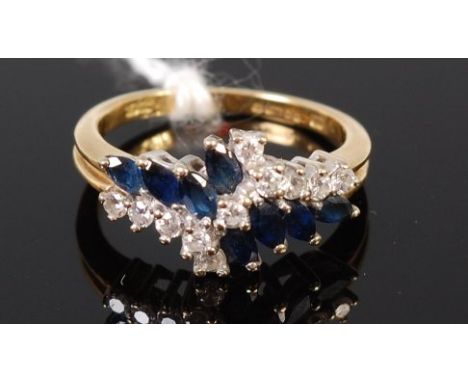 A modern 18ct gold, sapphire and diamond dress ring, size L, 3.8g