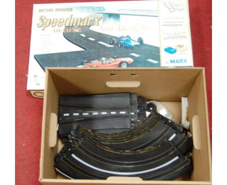 A boxed Marx Toys battery operated Speed Marks Deluxe Auto-Racing set, with track