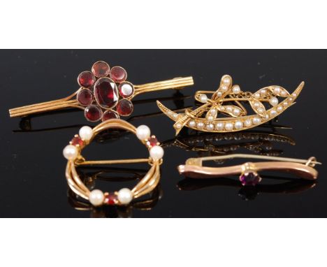 A 9ct gold, seed pearl and garnet set brooch, dia.2.3cm; together with a garnet bar brooch, an amethyst set bar brooch, and a