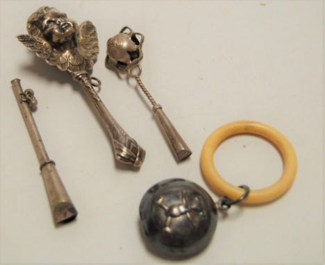 A George V silver baby's rattle, embossed with a teddybear, having ivory teething ring; together with two other baby's rattle