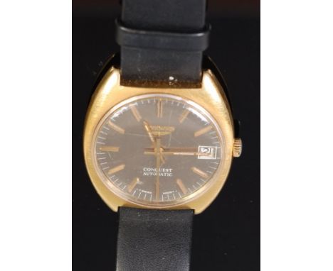 A 1970s gents Longines Conquest automatic wristwatch, having gold plated case and steel back, signed silvered dial with date 