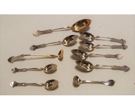 A set of five Art Nouveau style sterling silver grapefruit spoons; together with a larger matching single spoon; and a salt s