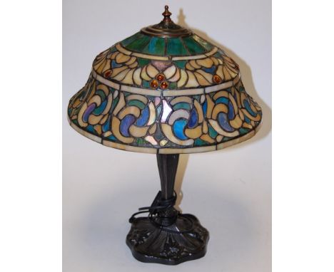 A reproduction Tiffany style table lamp having a leaded glass shade, height 50cm