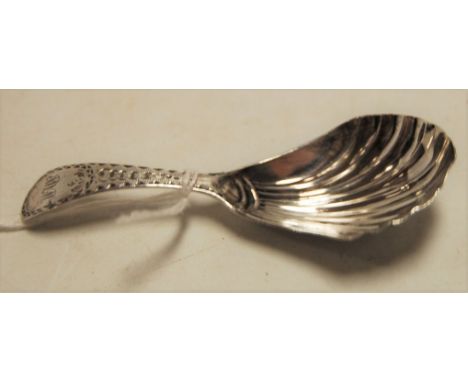 A George IV silver caddy spoon, having shell-shaped bowl and bright cut stem, maker William Bennett, London 1828
