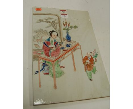 A Chinese famille rose porcelain plaque, enamel decorated with a seated maiden at a table before a screen observing a small b