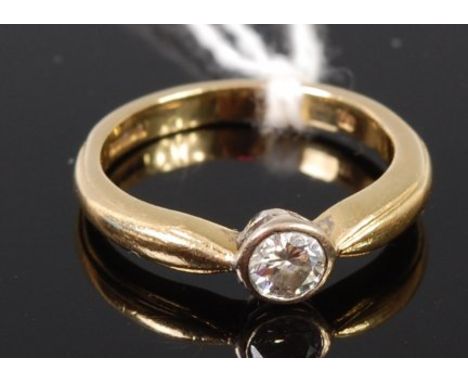 An 18ct gold diamond solitaire ring, the illusion set brilliant weighing approx 0.25ct, gross weight 4g, size K/L    Conditio