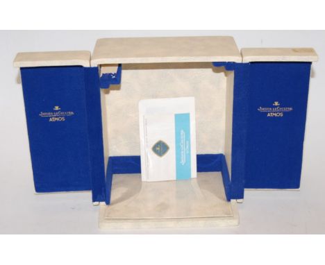 A cream leather clad Jaeger LeCoultre Atmos clock case only, with guarantee and booklet, together with a matching card outer 