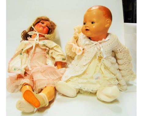 A Heinrich Handwerck bisque headed doll, having rolling blue eyes and open mouth with four teeth showing, with jointed compos